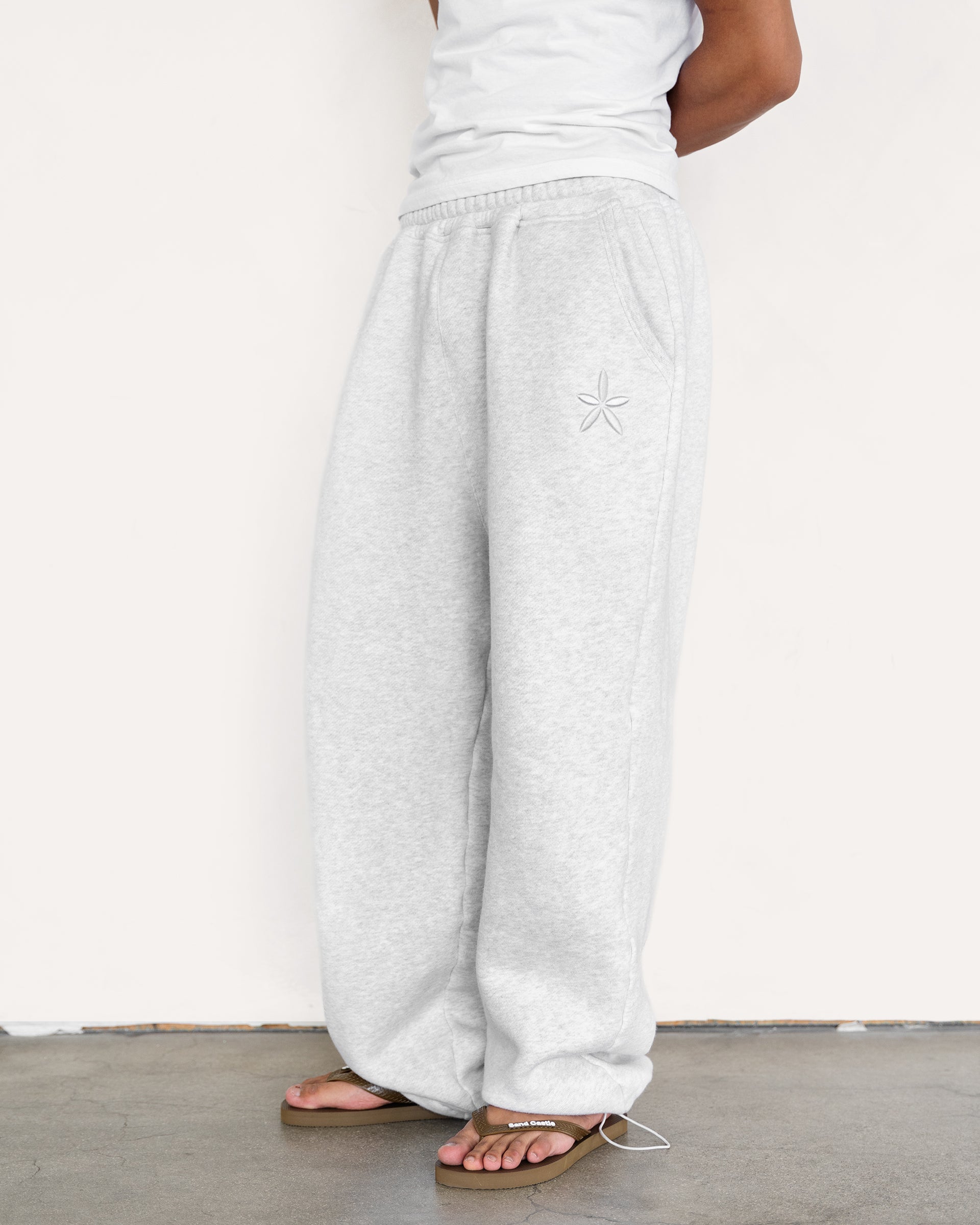 Relaxed fit sweatpants in heather grey, side view — Sand Castle Atelier