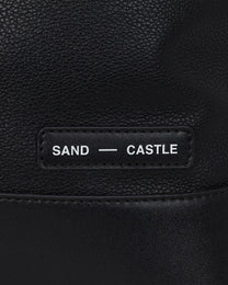 Sand Castle Atelier branded tag detail on Atelier Bag in Coal